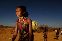 Young women from the Borona tribe, carrying wate,r. Omo valley, South Ethiopia. 2006