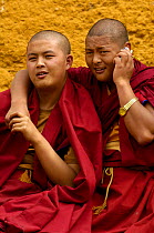 Two Monks from Songzhanling Monastery. One using a mobile phone, Zhongdian, Deqin Tibetan Autonymous Prefecture, Yunnan Province, China 2006