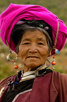 Tibetan woman with traditional jewellery and headdress at the Horse Racing Festival or 'Heavenly Steed Festival'. Zhongdian, Deqin Tibetan Autonymous Prefecture, Yunnan Province, China 2006