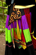 Close up of colourful belt Yi womans clothing - one of the sub-groups of the Yi Ethnic minority people from the mountains near Liuku, Nujiang Prefecture, Yunnan Province, China 2006