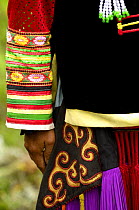 Close up of colourful belt Yi womans clothing - one of the sub-groups of the Yi Ethnic minority people from the mountains near Liuku, Nujiang Prefecture, Yunnan Province, China 2006