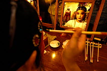 Performer from Sichuan Opera applying make up before her performance, Shu Feng Ya Yun Tea House in Chengdue, Shaanxi Province, China 2006
