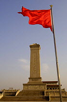 Red flag flying by Monument to the People's Heroes, Tiananmen Square, Beijing, China 2006