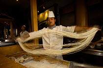 Chef making noodles, Xi'an, Shaanxi Province,  China 2006