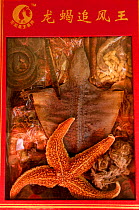 Packet containing starfish and other dried wildlife used for traditional medecine, Kunming Traditional Medicine Market, Yunnan Province, China 2006