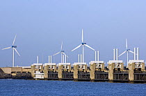 Storm flood barrier and wind turbines at Neeltje Jans, part of the Delta Works that regulates the enormous tidal flows and harnesses spring floods. The Netherlands