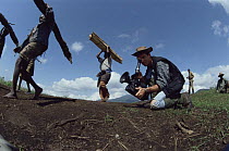 Bruce Davidson filming Hutu Rwandan refugees collecting fire wood close to Virunga NP, Dem Rep of Congo, circa 1994