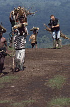 Camerman Bruce Davidson filming deforestation of Virunga NP by Rwandan Hutu refugees seeking fire wood, Dem Rep of Congo. circa 1994