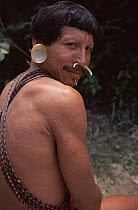 Matis hunter portrait, facial decorations mimic jaguar, Amazonia, Brazil
