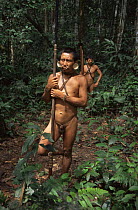 Matis hunters with traditional blowpipe weapons, facial decorations mimic jaguar, Amazonia, Brazil