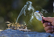 Lighting a fire with a magnifying glass, Norway 2006
