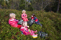 Girls in a Norwegian naturbarnehage (nature nursery) having lunch in the forest, Trondheim, Norway 2006