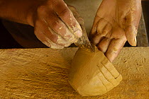 Quechua indian making coil ceramic bowls from clay dug out from the upper reaches of the Napo river, Ecuador, June 2005