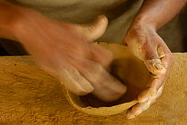 Quechua indian making coil ceramic bowls from clay dug out from the upper reaches of the Napo river, Ecuador, June 2005