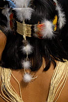 Headdress of Huaorani indian woman in Quito for a protest march against Petrobras, a Brazilian oil company who wanted to build another access road into Yasuni National Park, Ecuador, July 2005