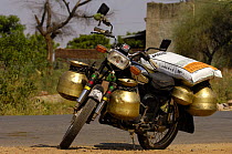 Motorbike with brass pots for collecting water. Bharatpur National Park / Keoladeo Ghana Sanctuary. Rajasthan, India, October 2006