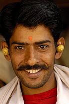 Rabari man of the Sorathi subgroup found in and around the Gir Forest National Park, wearing large ornate ear rings, Gujarat, India , 2006