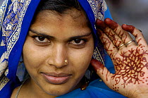 Hindu Woman with hand tatoos for the Diwali festival, near Bharatpur, Rajasthan, India 2006