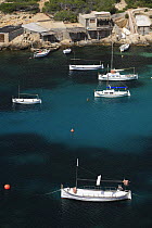 Boats moored up along Vedella creek, Ibiza, Balearic Islands, Spain
