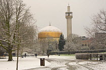 Regent's Park Mosque, dome and minaret,  in snow, London, UK.