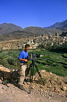 Camerman Mark Payne Gill on location in Bilad Sayt, Oman, April 1997, filming mountain village for BBC television programme