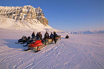 BBC NHU film crew travelling by snow mobile in search of Polar bears, on location for 'Blue planet', Svalbard, Norway, April 1996