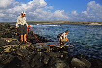 Sound recordists Chris Watson and Joe Stevens recording underwater sounds of sealions, Galapagos