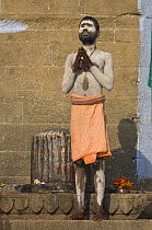 Sadhu / holy man praying, Varanasi, Uttar Pradesh, India. Feb 2007