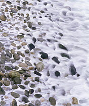 Waves surging onto a pebble beach, Monterey Coast, California, USA