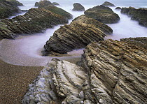 Long exposure of  surging tide on the beach at Spooner's Cove, Montana De Oro State Park, California, USA