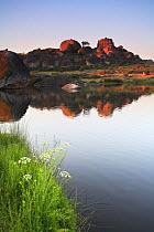 Rock formations and reflection in lake, Los Barruecos NP, Malpartida de Caceres, Extremadura, Spain