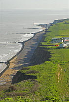 View along north Norfolk coastal cliffs, with sea defences, UK