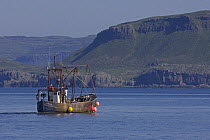 Scottish inshore trawler fishing for Dublin Bay prawns off the Isle of Mull, Inner Hebrides, Scotland. June.