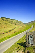 Road leading into Abergwesyn Common, National Trust. A grass and heather covered plateau, dissected by a deep river valley. Powys, Wales
