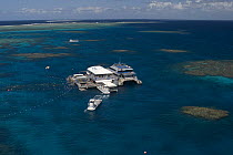 Aerial view of the Great Barrier Reef with tourist dive boats. Agincourt Reefs, off Port Douglas, Australia