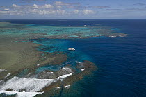Aerial view of the Great Barrier Reef with tourist boat. Agincourt Reefs, off Port Douglas, Queensland
