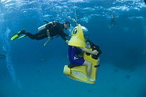Tourist on Scubadoo with diver from the Great Adventures Pontoon. Great Barrier Reef, Queensland, Australia 2006