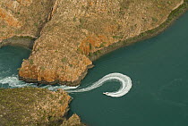 Aerial view of a boat driving through the horizontal waterfall, located within Talbot Bay in the Buccaneer Archipelago. Derby, Western Australia
