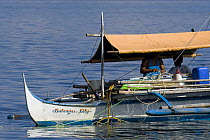 Aquarium trade fishermen on huka. Paint compressor supplies air to the fishermen who can stay underwater long to catch ornamental fish. Verde Island, Mindoro, Philippines