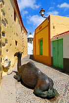 Bronze camel sculpture in the narrow streets of Aguimes Village, Gran Canaria Island, the Canary Isles, Spain, September 2007