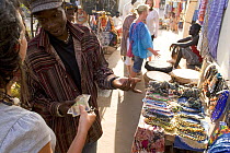 Tourists shopping at Senegambia craft market, Gambia, 2007