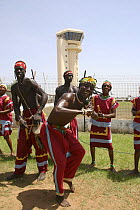 Traditional dance troupe performing outside Banjul international airport, Gambia, 2007
