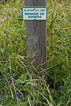 Adder (Vipera berus) warning sign, Slapton Ley National Nature Reserve, Devon, UK