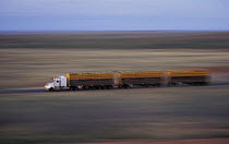Road train truck crossing the desert, Pilbara Region, Western Australia