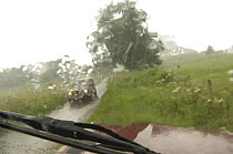 View through car windscreen during downpour, country lane, Yorkshire, England