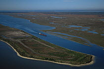 Aerial view of Aransas NW reserve and cargo boat passing down the intracoastal waterway, Gulf of Mexico, Texas, USA, 2001