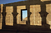 Shadow of pillars against a stone wall, Philae Temple, Aswan, Egypt, 2007