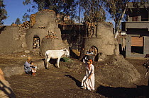 Egyptian people and donkey outside pottery kiln, Nile Delta, Egypt, 2000