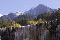 Waterfall with mountains in background, Juizhaigou National Reserve, UNESCO World Heritage Site, Sichuan Province, China, October 06. 'Wild China' series