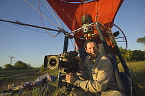 Cameraman Warwick Sloss in specially adapted hot air balloon, preparing to film Baobab trees in Morondava, Western Madagascar for BBC series  Planet Earth 'Forests'